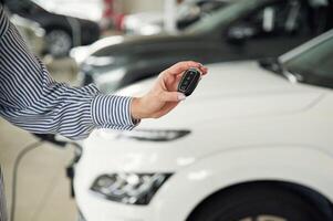 Close up view of, woman that is with electric car photo