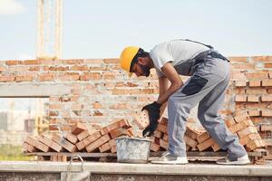 Focused, on ,work. Handsome Indian man is on the construction site photo