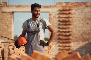 Handsome, Indian man, is on the construction site photo