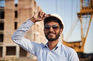 Portrait ,of handsome Indian ,man that is on the construction site photo