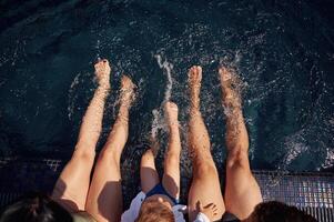 Top view. Happy family of father, mother and son are in the pool photo