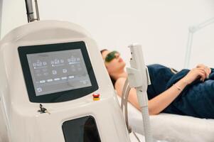 Modern device., Getting photo rejuvenation procedure at cosmetology clinic. Women in beauty salon
