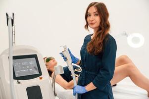 Modern device.,. Getting photo rejuvenation procedure at cosmetology clinic. Women in beauty salon
