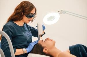 Conception of beauty,. Getting photo rejuvenation procedure at cosmetology clinic