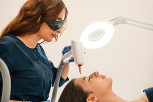 Conception ,of beauty. ,Getting photo rejuvenation procedure at cosmetology clinic