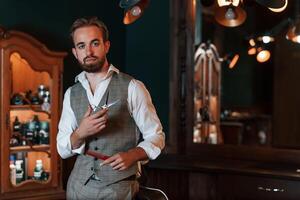 Handsome barber is in the salon., photo