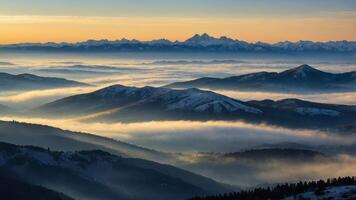 Serene mountain landscape at dawn with mist and distant peaks. photo