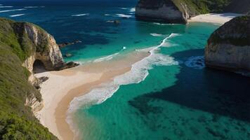 Aerial view of a serene beach with turquoise waters and lush green cliffs. photo