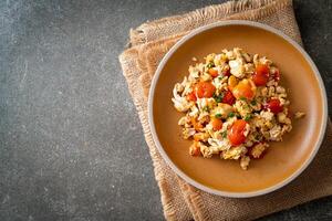 stir-fried tomatoes with egg on plate. photo