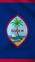Vertical, portrait, waving national flag of Guam. Smooth animation with highly detailed, realistic animated background for social media, screens smartphone. Official colors cloth motion video