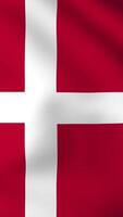 Vertical, portrait waving national flag of Denmark. Smooth animation with highly detailed, realistic animated background for social media, screens smartphone. Official colors, cloth motion. video