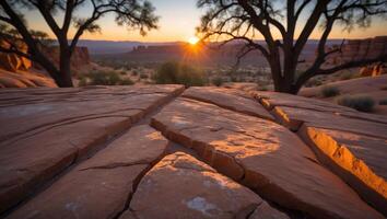 Desert Rock Formation at Sunset with Trees and Mountain Scenery photo