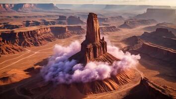 Rock Formation in Desert Landscape with Low Clouds and Pathways photo
