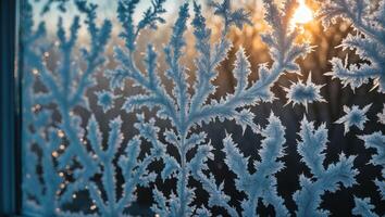 Frost Patterns on Window with Sunlight Shining Through Winter Scene photo