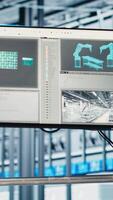 Vertical Close up of display in smart factory used to test automated systems, ensuring reliability. Monitor in industry 4.0 industrial plant used to identify bottlenecks and optimize equipment video