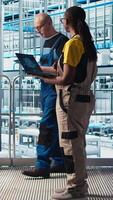 Vertical Photovoltaics smart factory engineer using artificial intelligence to discover new PV materials. Industry 4.0 solar panels plant specialist using Ai to develop green energy systems prototype, camera A video