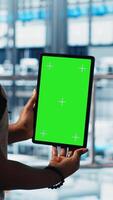 Vertical Robotics technician using chroma key device in smart factory calibrating IoT sensors, close up. Engineer using isolated screen tablet in industry 4.0 industrial plant to install machinery video