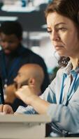 Vertical Upset employee in office dejected by bad news after reading negative email from business partner. Dejected worker frowning after failed client acquisition attempt, camera A video