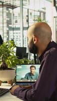 Vertical Business manager on videocall with worker attending briefing meeting to share new ideas to profit growth. Specialist in online telework call using tablet to explain startup evolution vision, camera B video