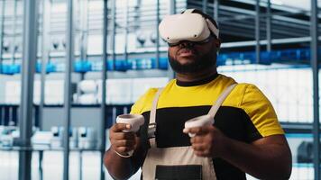 Smart factory expert using VR headset to test automated systems and ensure reliability. Worker virtual reality tech to identify bottlenecks and optimize gear based on sensors data, camera A video