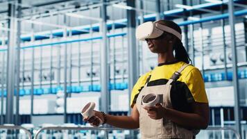 Photovoltaics smart factory technician fixing damaged IoT sensors using VR headset. Engineer in industry 4.0 solar panels plant using virtual reality find errors and reduce downtime, camera A video