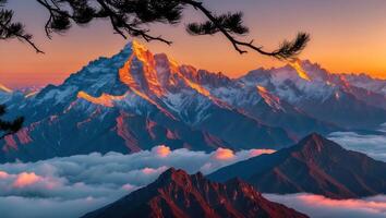 Snowy Mountain Peaks at Sunset Above Clouds with Silhouetted Branch photo