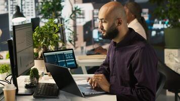 Jolly bookkeeper at work happy after finally finishing reading and verifying business documents. Cheerful employee pleased after finishing analyzing company information records, camera A video