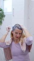 Transforming hair color in a bright bathroom setting with care video
