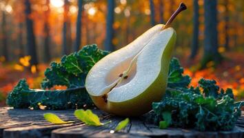 Sliced Pear with Kale on Wooden Surface in Autumn Forest photo