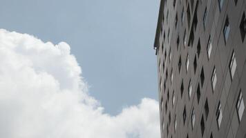 Abstract image of looking up at modern glass and concrete building photo