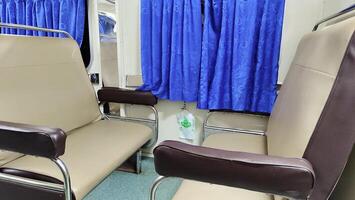 Train seats or interior of the train, empty passengers in the economy class train carriage. photo