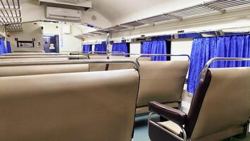 Train seats or train interior, empty passengers in train carriages. photo