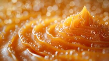 A close-up of vibrant orange bubbling liquid creates a captivating texture with soft, flowing waves and sparkling bubbles. photo