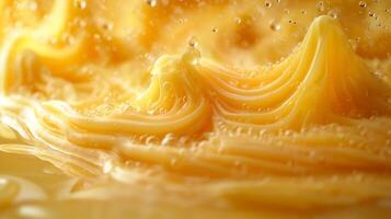 Close-up of vibrant golden liquid swirling with bubbles, creating an abstract texture reminiscent of molten lava. photo