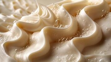 Close-up of creamy, textured frosting with bubbles, showcasing a delightful wave pattern. photo