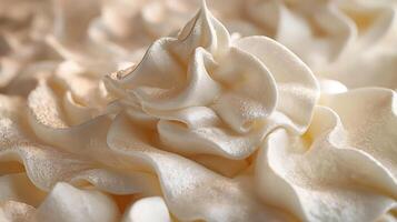 Close-up of creamy whipped topping in soft, elegant swirls, perfect for dessert decoration. photo
