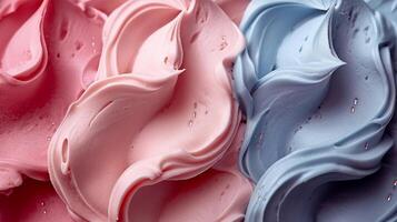 A vibrant swirl of pink and blue whipped cream, creating a delightful and inviting texture. photo