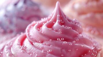 Close-up of a vibrant pink cupcake frosting, decorated with tiny colorful sugar beads, creating a delightful dessert image. photo