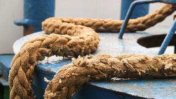 Very large ferry ropes are used to tie up ships when they are anchored in a harbor. photo