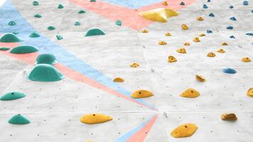 The climbing holds can be rearranged to create new and challenging routes photo