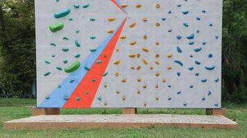 Most climbing walls are equipped with harnesses, photo