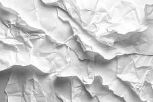 A close-up of crumpled white paper, showcasing intricate textures and shadows. photo