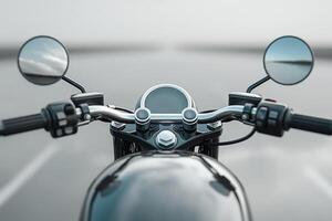 Close-up of a motorcycle handlebar with a foggy road ahead, inviting adventure and freedom. photo