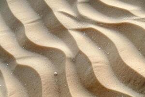 Close-up of smooth, undulating sand patterns illuminated by soft sunlight, creating a tranquil and serene atmosphere. photo