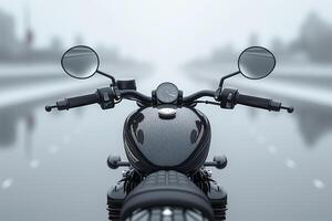 A sleek black motorcycle's handlebars are viewed from the front, surrounded by a misty road atmosphere. photo