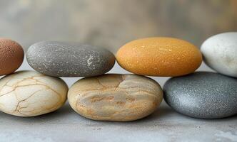 A beautiful arrangement of smooth, colorful stones, showcasing various textures and hues for a calming aesthetic. photo