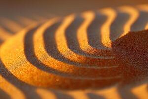 Close-up of golden sand patterns creating a captivating play of light and shadow. photo