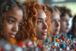 A diverse group of young students focused on molecular models, showcasing dedication to science and learning. photo