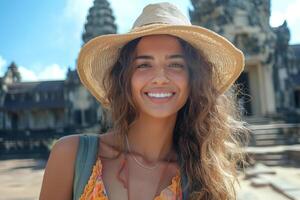 Smiling young woman of Latin descent in a sun hat, exploring ancient architecture on a sunny day. photo