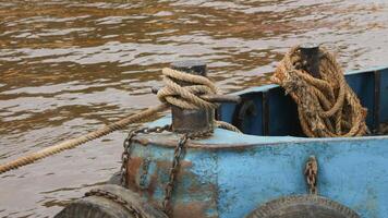 a very large ship's rope is used to tie up ships when they dock at the port. photo